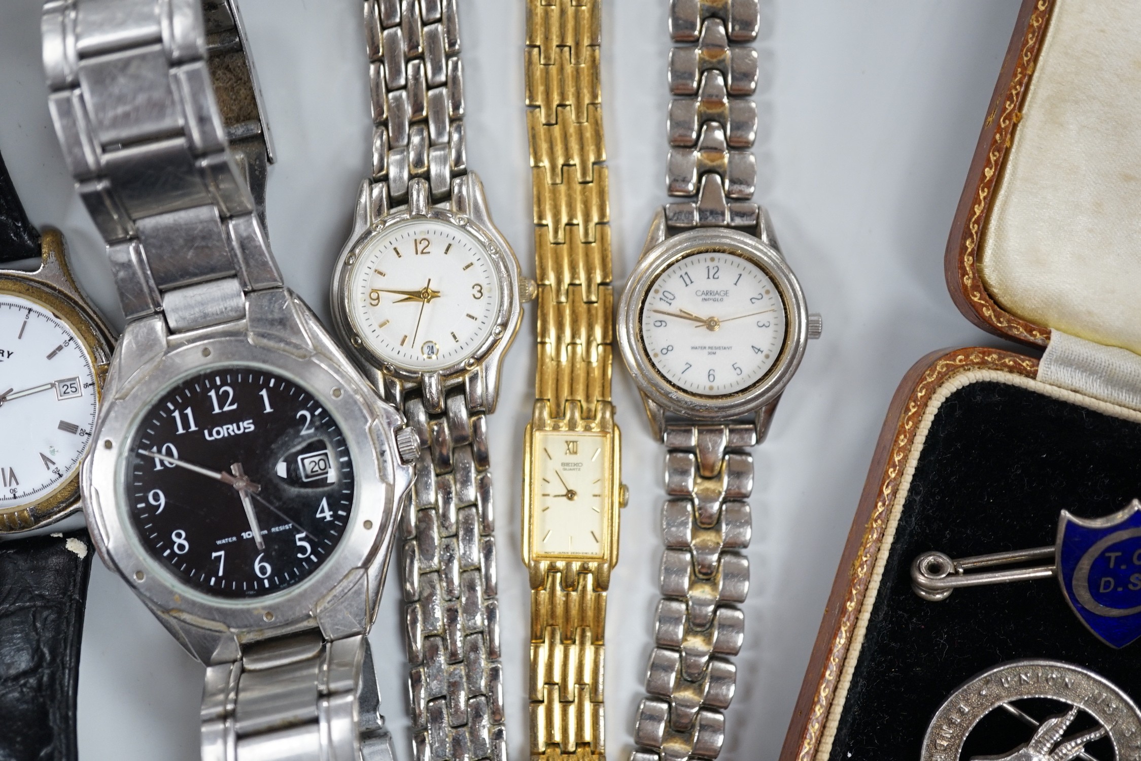 Seven assorted modern wrist watches including Pulsar and Rotary, a 9ct and 'silver' eternity ring, a case amber cigarette holder and two white metal brooches, including one with enamel.